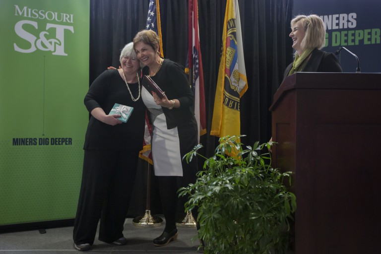 Missouri S&T professor Suzanna Long, left, embraces Cynthia Tang as Chancellor Cheryl B. Schrader looks on. Long was named the Missouri S&T Woman of the Year on Wednesday, April 20. Tang, a member of the Missouri S&T Board of Trustees, funds the award. Photo by Sam O’Keefe/Missouri S&T